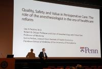 Man standing in front of the PowerPoint presentation